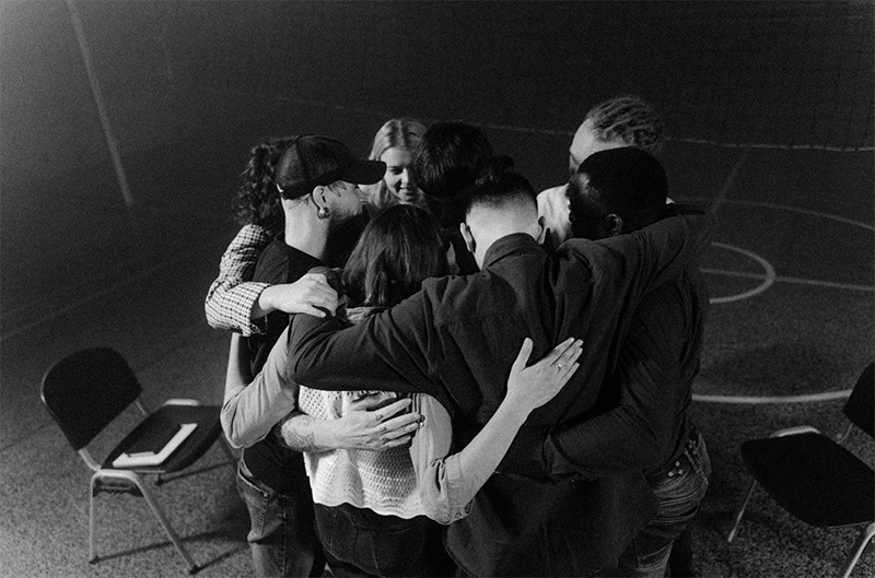 Group of people in a group hug