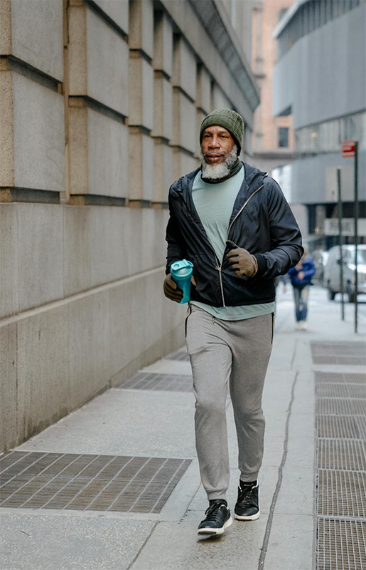 Man Jogging on a Sidewalk