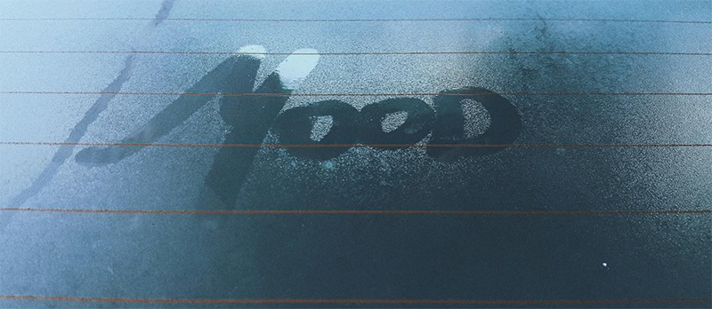 The word Mood written in condensation on a car window