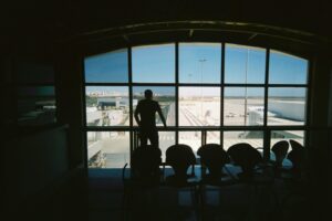 Man at airport traveling while on testosterone replacement therapy.